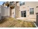 Cozy backyard featuring a concrete patio, grass, and exterior door at 6233 Pesta Ct, Raleigh, NC 27612