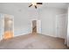 Spacious bedroom with ensuite bathroom, plush carpeting, and ample natural light at 6233 Pesta Ct, Raleigh, NC 27612