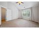 Bright bedroom featuring vaulted ceilings, a large window, and neutral carpeting at 6233 Pesta Ct, Raleigh, NC 27612