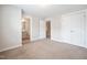 Comfortable bedroom with ensuite bathroom, plush carpeting and ample storage at 6233 Pesta Ct, Raleigh, NC 27612