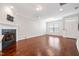 Spacious living room with hardwood floors, a fireplace, and lots of natural light at 6233 Pesta Ct, Raleigh, NC 27612