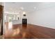 Open-concept living room showcases hardwood floors, a fireplace, and abundant natural light at 6233 Pesta Ct, Raleigh, NC 27612