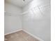 Functional walk-in closet with built-in wire shelving, ready for storage and organization at 6233 Pesta Ct, Raleigh, NC 27612