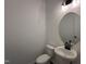 Modern half bath with sleek fixtures, oval mirror and pedestal sink at 704 Compeer Way # 28, Rolesville, NC 27571