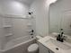 Modern bathroom featuring tub and shower combination, with a quartz countertop at 704 Compeer Way # 28, Rolesville, NC 27571