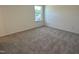 Cozy bedroom with neutral carpeting and a bright window letting in natural light at 704 Compeer Way # 28, Rolesville, NC 27571
