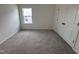 Cozy bedroom features plush carpet and a bright window for natural light at 704 Compeer Way # 28, Rolesville, NC 27571