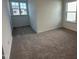 Bedroom features two bright windows that illuminate the neutral carpet at 704 Compeer Way # 28, Rolesville, NC 27571