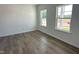 Bright bedroom with lots of natural light from two windows and luxury vinyl flooring at 704 Compeer Way # 28, Rolesville, NC 27571