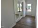 Bright entryway featuring hardwood floors and a glass door with modern finishes at 704 Compeer Way # 28, Rolesville, NC 27571
