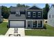 Charming two-story home with a two-car garage and well-manicured lawn at 704 Compeer Way # 28, Rolesville, NC 27571