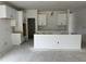 Kitchen with white cabinets and a central island at 704 Compeer Way # 28, Rolesville, NC 27571