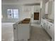 Kitchen with white cabinets and a central island at 704 Compeer Way # 28, Rolesville, NC 27571