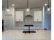 Bright and modern kitchen featuring stainless steel appliances and pendant lighting at 704 Compeer Way # 28, Rolesville, NC 27571
