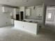 Kitchen with white cabinets and a central island at 704 Compeer Way # 28, Rolesville, NC 27571
