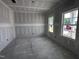 Bright, unfinished living room featuring large windows for ample natural light at 704 Compeer Way # 28, Rolesville, NC 27571