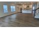 Open-concept living space with recessed lighting, hardwood floors, and a view of the modern kitchen at 704 Compeer Way # 28, Rolesville, NC 27571