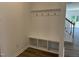 Bright mudroom area with a built-in bench, coat hooks, and storage cubbies, perfect for organization at 704 Compeer Way # 28, Rolesville, NC 27571