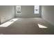 Light-filled room showcasing two windows for ample natural light at 704 Compeer Way # 28, Rolesville, NC 27571