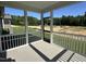 Relaxing screened porch with views of the backyard and surrounding greenery at 704 Compeer Way # 28, Rolesville, NC 27571