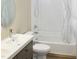 This well-lit bathroom features a tub and shower combination and a vessel sink at 735 Alexander Ave, Henderson, NC 27536