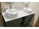 Modern bathroom vanity featuring vessel sinks, sleek faucets, and stylish cabinetry at 735 Alexander Ave, Henderson, NC 27536