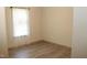 Bedroom featuring wood-style floors and a sunlit window at 735 Alexander Ave, Henderson, NC 27536