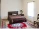 This bedroom has a decorative wall, a decorative rug and a comfy bed at 735 Alexander Ave, Henderson, NC 27536