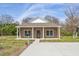 Inviting front exterior of home featuring a charming facade and well-manicured lawn at 735 Alexander Ave, Henderson, NC 27536