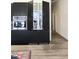 Modern kitchen with sleek dark cabinetry and stainless steel appliances at 735 Alexander Ave, Henderson, NC 27536