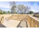 Newly constructed wooden back deck area in backyard is ready for entertaining Gathering and friends at 818 E Holly St, Rocky Mount, NC 27801