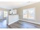 Modern kitchen featuring bright windows and a view into the living room at 818 E Holly St, Rocky Mount, NC 27801