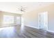 Open living room with door to the outside, interior doors, and modern hard wood floors at 818 E Holly St, Rocky Mount, NC 27801