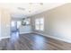 Bright living room featuring hard wood flooring and a view into the kitchen at 818 E Holly St, Rocky Mount, NC 27801