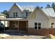 New construction home featuring a brick and siding exterior with modern architectural details at 829 Chapel Ridge Dr, Pittsboro, NC 27312