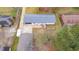 An aerial view of the home showcasing the backyard deck and surrounding greenery at 928 Hanford Rd, Graham, NC 27253