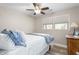 Comfortable bedroom boasts natural light, ceiling fan, and an attractive color scheme at 928 Hanford Rd, Graham, NC 27253