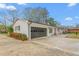 White brick home featuring an attached garage and a well-kept yard at 928 Hanford Rd, Graham, NC 27253