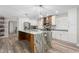 Modern kitchen featuring a large marble island, stainless steel appliances, and stylish pendant lighting at 928 Hanford Rd, Graham, NC 27253