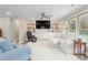 Inviting living room with a large screen TV, custom built-ins, and a cozy white couch at 928 Hanford Rd, Graham, NC 27253