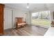 Sun-lit room featuring a wooden bench, ample natural light, and views of the outdoors at 928 Hanford Rd, Graham, NC 27253