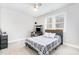 Bedroom with grey carpet and white ceiling fan at 100 High Ridge Ln, Pittsboro, NC 27312