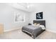Modern bedroom with grey carpet and dark bedframe at 100 High Ridge Ln, Pittsboro, NC 27312