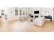 Open-concept living area featuring hardwood floors, a fireplace and a view into the dining area at 100 High Ridge Ln, Pittsboro, NC 27312
