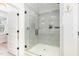 Modern shower with glass door and gray tiling at 100 High Ridge Ln, Pittsboro, NC 27312