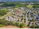 Scenic aerial view shows neighborhood layout, nearby green spaces, and easy access to roadways at 1009 Limeberry Ct, Clayton, NC 27520