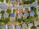 Overhead shot of a home showing the backyard, landscaping, and proximity to the street and surrounding neighborhood at 1009 Limeberry Ct, Clayton, NC 27520
