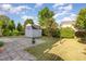 The large backyard features a well-maintained lawn, patio, landscaping, and storage shed at 1009 Limeberry Ct, Clayton, NC 27520
