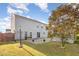 View of backyard with patio area, landscaping, storage shed and grassy lawn for outdoor enjoyment at 1009 Limeberry Ct, Clayton, NC 27520