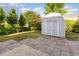 The large backyard features a well-maintained lawn, patio, landscaping, and storage shed at 1009 Limeberry Ct, Clayton, NC 27520